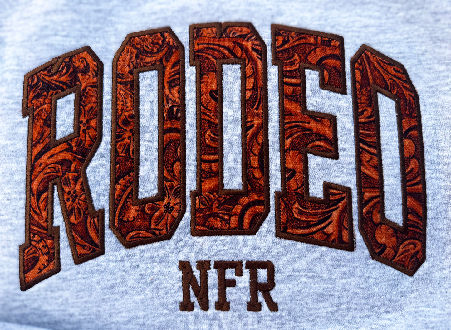Leather Rodeo Embroidered Sweatshirt – Western Flair with Faux Leather Detail